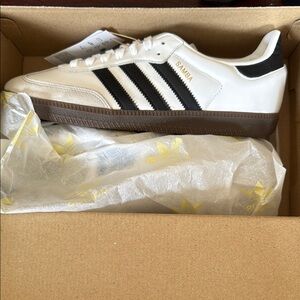 Adidas White and Black Sneakers with Iconic Stripes
